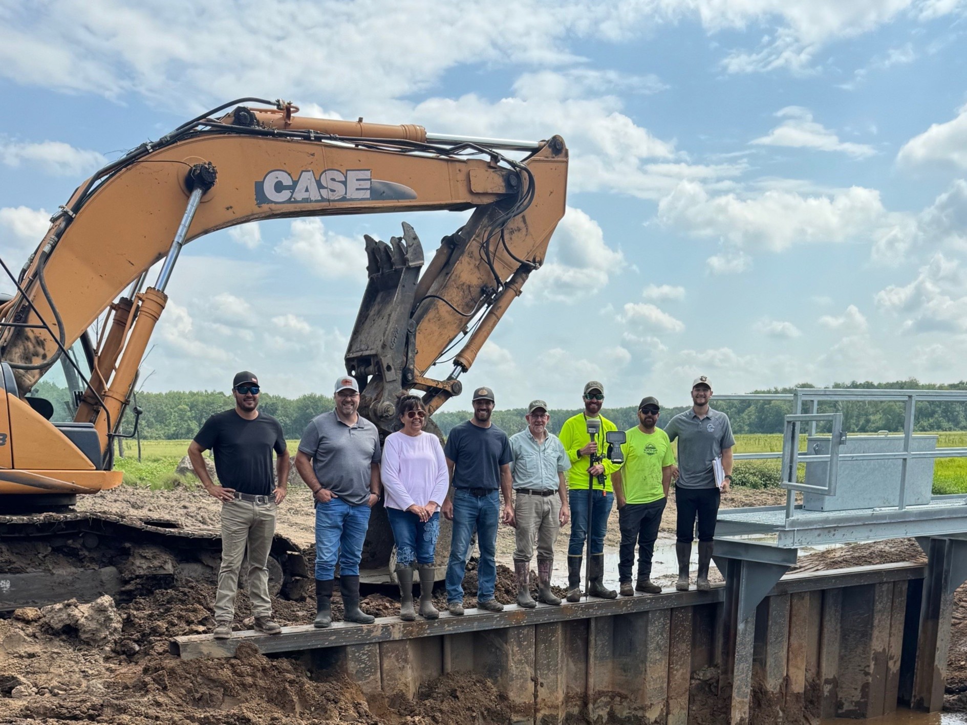 Group photograph showing Ducks Unlimited and Mille Lacs Band employees working on wetland restoration.