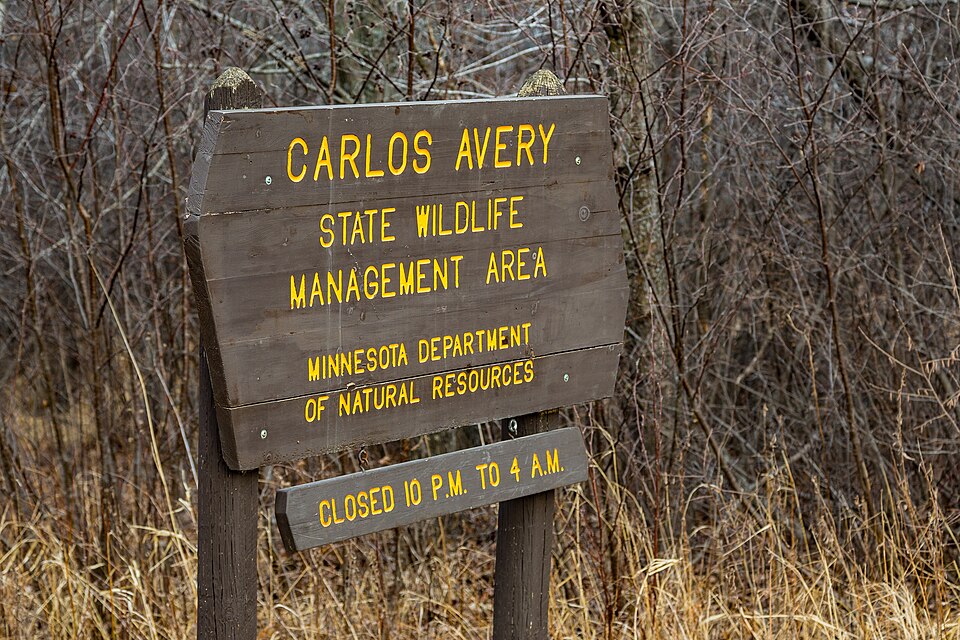 A sign for the Minnesota Department of Natural Resources' Carlos Avery State Wildlife Management Area .