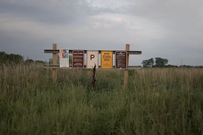 Signs show the partnerships that lead to the creation of the Roseneau-Lambrecht WMA in Brown County, Minnesota.