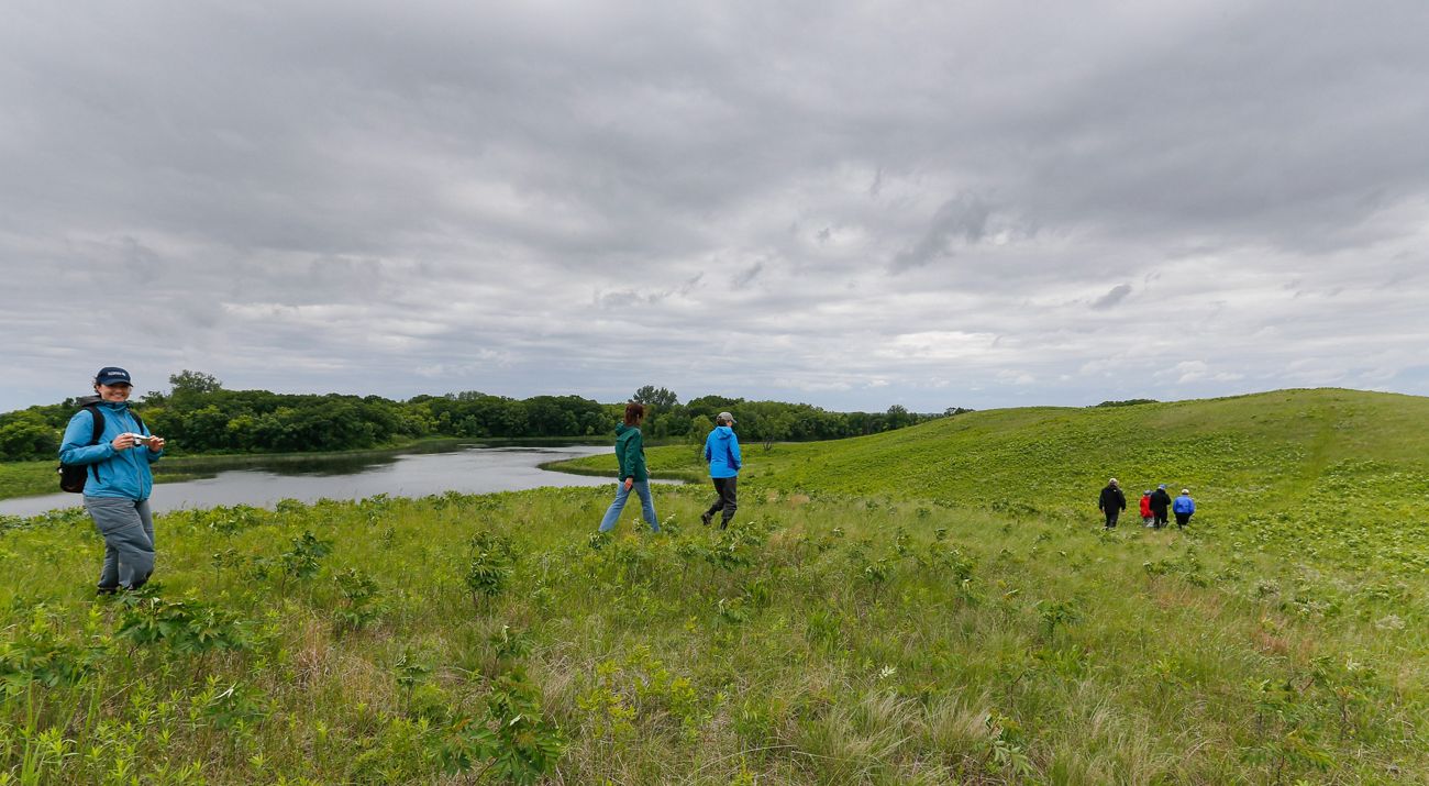 People walk on protected prairie in Minnesota.