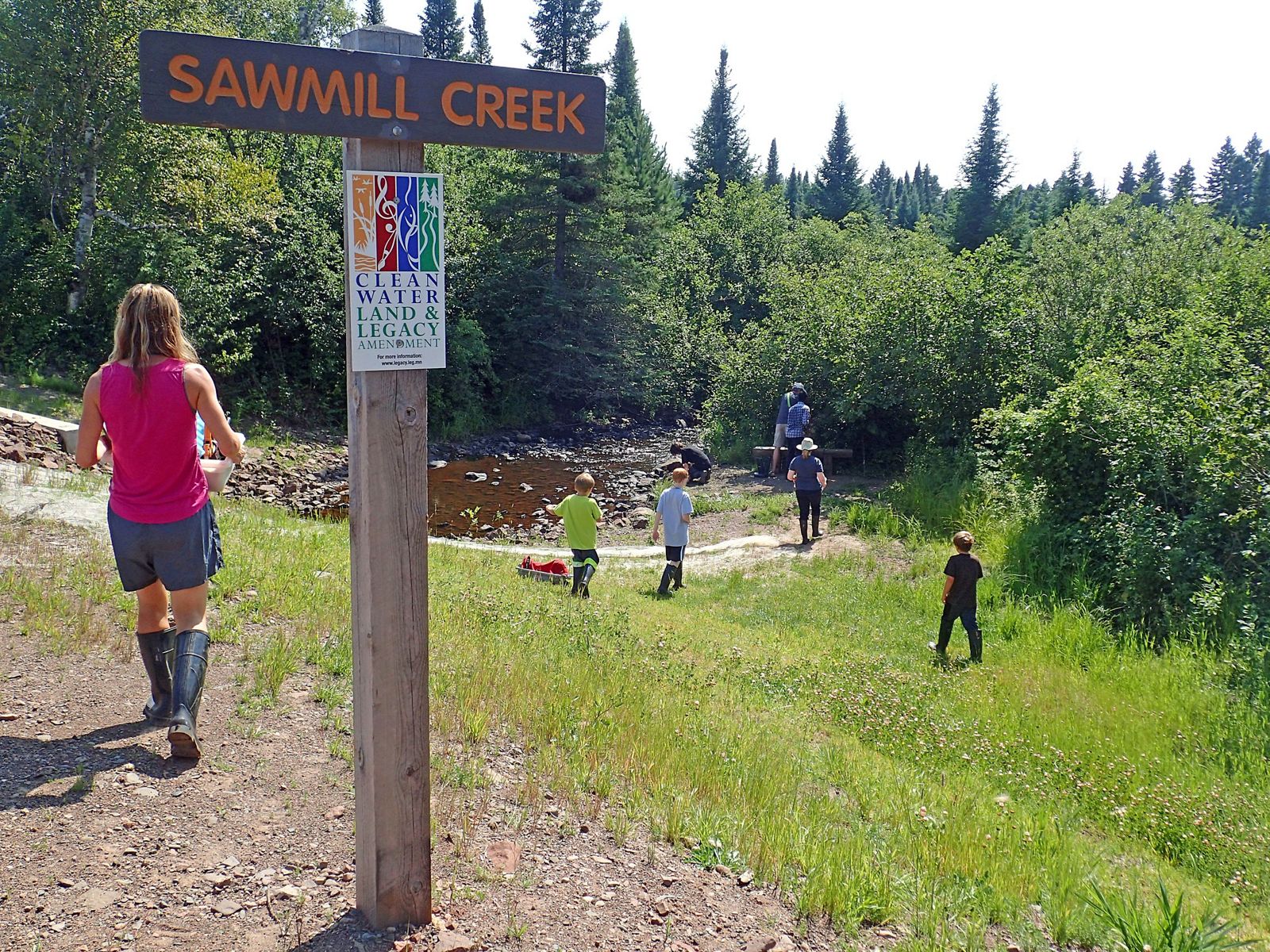 Visitors explore the Sawmill Creek area within the protected Wolf Ridge area easement.