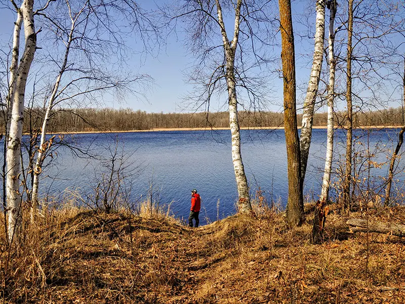 Visitor hikes along the shore of Indian Jack Lake.
