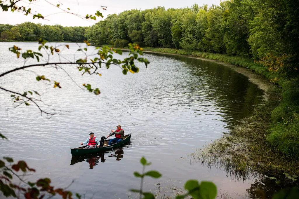 Kayakers in a lake within the Sheep Ranch protected property.